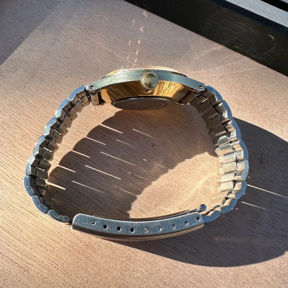 Timex Gold and Silver Watch with Date Display